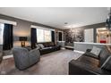 A comfortable living room featuring neutral carpet and plush seating at 1020 E 51St St, Indianapolis, IN 46205