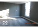 Neutral bedroom with natural light, featuring carpeted floors at 1311 E Hines St, Muncie, IN 47303