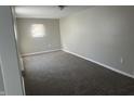 Neutral bedroom featuring new carpeting, natural light, and modern fixtures at 1624 S Jersey Ave, Muncie, IN 47302