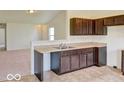 Open-concept kitchen with sleek, dark cabinetry and a functional layout at 3693 Berkdale Dr, Columbus, IN 47203