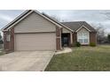 Charming single-Gathering home featuring brick and siding, a two-car garage, and well-maintained lawn and landscaping at 4819 Lakestone Dr, Indianapolis, IN 46237