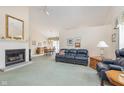 Spacious living room boasts vaulted ceilings, fireplace, and ample natural light at 9694 River Oak E Ln, Fishers, IN 46038