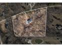 Aerial view showcasing the property's boundaries, mature trees, and proximity to neighboring homes at 1285 W Judson Ln, Mooresville, IN 46158