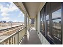 Inviting covered porch with classic columns and serene neighborhood views at 17364 Pinellas Ave, Westfield, IN 46074