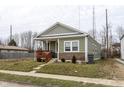 Quaint single-Gathering home showcasing a cozy front porch and well-maintained lawn at 1820 E Maryland St, Indianapolis, IN 46201