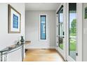 Bright and modern entryway with natural light, wood floors, and stylish accents at 2026 Alvord St, Indianapolis, IN 46202