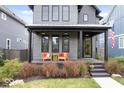 Inviting front porch with seating area, stylish decor, and attractive landscaping at 2026 Alvord St, Indianapolis, IN 46202