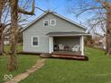 Charming house with a welcoming front porch and well-maintained lawn at 208 S Conger St, , IN 47272