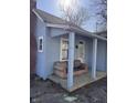 Inviting front porch with seating and a classic design at 2933 E 56Th St, Indianapolis, IN 46220