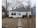 Quaint one-story house with a neat front yard and inviting entrance walkway at 2959 N Lasalle St, Indianapolis, IN 46218