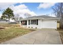 Ranch-style home with driveway and well-manicured lawn, offering curb appeal at 3626 St. Charles St, Anderson, IN 46013