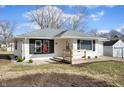 Ranch style home featuring a well-kept lawn, updated front porch, and white siding at 3626 St. Charles St, Anderson, IN 46013