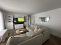 Bright living room featuring a comfortable sectional sofa and built-in shelving at 3703 Church Dr, Anderson, IN 46013