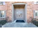 Inviting front entrance with elegant double doors and brick surround at 5525 Roxbury Ter, Indianapolis, IN 46226