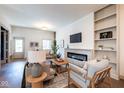 Inviting living room with fireplace, built-in shelving, and comfortable seating at 5537 Broadway St, Indianapolis, IN 46220