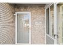 Close-up of a front door with brick surround and house number at 5721 Quail Crossing Dr, Indianapolis, IN 46237