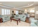 Open-concept living area featuring hardwood floors, stylish furniture, and lots of natural light at 6400 Woodland Ln, McCordsville, IN 46055