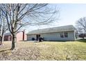 Spacious backyard with a concrete patio, perfect for outdoor entertaining at 7674 Bayhill Dr, Indianapolis, IN 46236