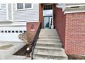 Inviting front entrance of home with steps and brick accents at 9640 Clover Leaf Ln, Fishers, IN 46038