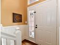 Charming entryway featuring hardwood floors and a decorative front door at 9640 Clover Leaf Ln, Fishers, IN 46038