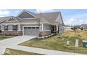 Charming home with a two-car garage and well-maintained lawn at 11758 Harvester S Cir, Noblesville, IN 46060