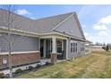 Inviting home exterior with a covered porch and manicured landscaping at 11758 Harvester S Cir, Noblesville, IN 46060