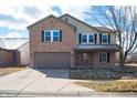 Inviting two-story home with brick and siding, attached garage, and a well-kept lawn at 1841 Sonesta Ln, Indianapolis, IN 46217