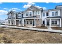 Eye-catching townhouses showcase a variety of exterior finishes at 19511 Grassy Branch Rd, Westfield, IN 46074
