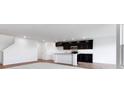 Open kitchen featuring dark cabinets, stainless appliances, and a central island at 2150 Aviary Ln, Danville, IN 46122