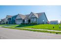 Attractive single-story home with a manicured lawn, two car garage and tasteful siding at 2349 S Copperstone Dr, New Palestine, IN 46163