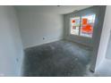 Bright bedroom with a large window and clean, white walls at 24409 Stout St, Sheridan, IN 46069