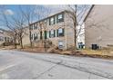 Charming townhome with brick facade and landscaped front at 3039 Armory Dr, Indianapolis, IN 46208