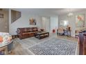 Spacious living room featuring modern hardwood floors and chandelier at 3039 Armory Dr, Indianapolis, IN 46208