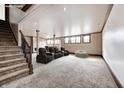 Finished basement with plush carpeting, and entertainment seating at 3236 Wildlife Trl, Zionsville, IN 46077