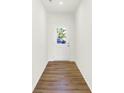 A bright entryway features a white door with glass and wood laminate flooring at 3687 Thomas Jefferson Ct, Westfield, IN 46074