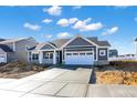 Attractive single-story home with a manicured lawn and attached two-car garage on a sunny day at 3687 Thomas Jefferson Ct, Westfield, IN 46074
