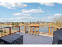 Enjoy this spacious deck featuring outdoor bar and grill, perfect for entertaining with scenic lake views at 7370 Chestnut Hills Blvd, Indianapolis, IN 46278