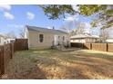 Quaint backyard offers privacy with a wood fence, perfect for outdoor enjoyment at 1019 Lennox St, Anderson, IN 46012