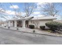 Charming single story home with an inviting walkway to the front entrance and attached garage at 1020 W Riverview Dr, Anderson, IN 46011