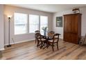 Cozy dining room with natural light, wooden table and chairs, and stylish decor at 10230 Tournon Dr, Fishers, IN 46037