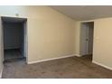 A basic living room with neutral carpet, offering a blank canvas for personalization at 1126 N Mitthoeffer Rd, Indianapolis, IN 46229