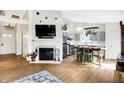 Open-concept living room featuring a fireplace and a seamless transition into the kitchen at 12601 Slippery Rock Rd, Indianapolis, IN 46236