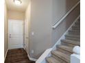Inviting entryway featuring a staircase and convenient access to the upper level at 14309 Shooting Star Dr, Noblesville, IN 46060