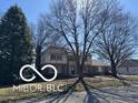 Attractive home with a manicured lawn and mature trees provides excellent curb appeal at 15237 Citation Rd, Carmel, IN 46032
