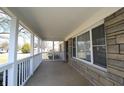 Inviting front porch of a charming home, featuring stone facade and ample natural light at 1739 Forest Dr, Indianapolis, IN 46227