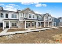 New two-story townhomes featuring brick and various colored siding at 19499 Grassy Branch Rd, Westfield, IN 46074