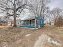 Cozy sunroom addition offers abundant natural light and complements the exterior of this charming home at 2370 N Moreland Ave, Indianapolis, IN 46222