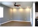 Bright living room with a ceiling fan and recessed lighting showcasing the beautiful floors at 2908 N Colorado Ave, Indianapolis, IN 46218