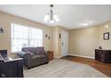 Cozy living room with neutral walls, plush carpeting, a large window, and comfortable seating at 3079 Limber Pine Dr, Whiteland, IN 46184