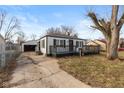 Charming home with a spacious front deck, detached garage, and classic curb appeal at 317 Albany St, Indianapolis, IN 46225